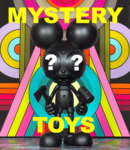 Black Space Monkey toy with question marks for eyes holding an axe and a hammer under the words MYSTERY TOYS, in front of a colorful DALEK mural